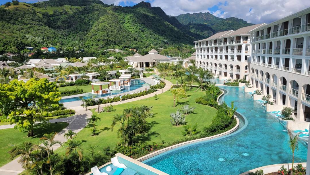 Aerial view of Sandals resort with pools and beachfront lagoon